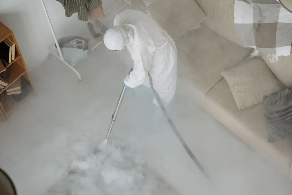 Biohazard cleanup technician in protective equipment, Eastmont, WA